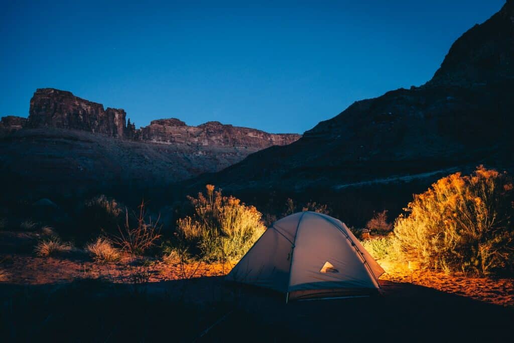 photo of a white tent pitched on the beautiful landcape of red rock canyon