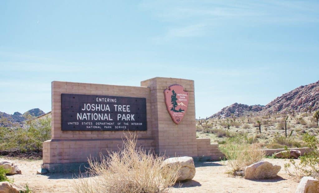 photo of an entrance sign to Joshua National Park, covered in the Joshua Tree Climbing Guidebooks article.