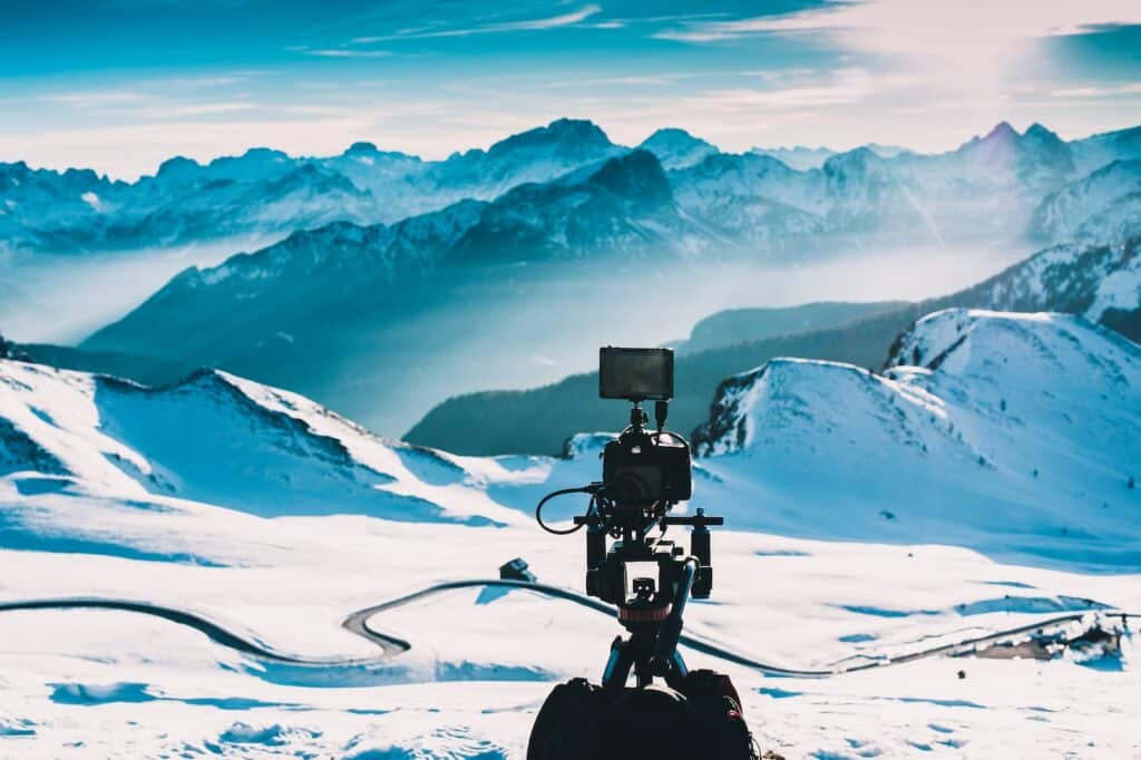 photo of camera set up on a snowy mountain peak, illustrating ice climbing documentaries